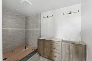 Full bathroom featuring tiled shower