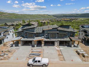 View from above of property with a mountain backdrop
