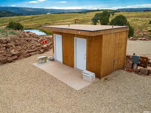 View of outbuilding with a mountain view