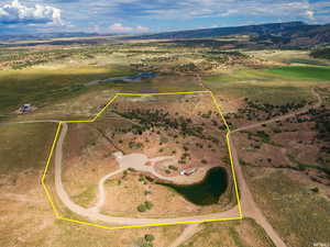 View of rural area featuring a mountain backdrop and property parcel outlined