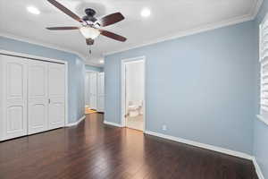 Unfurnished bedroom with recessed lighting, a closet, baseboards, wood finished floors, and ornamental molding
