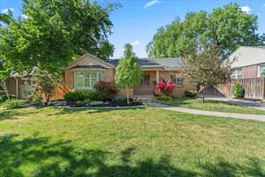 Ranch-style house featuring brick siding