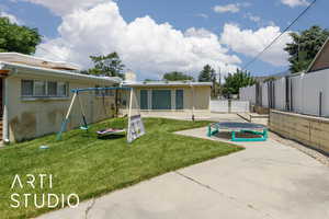 View of yard with a patio and a trampoline