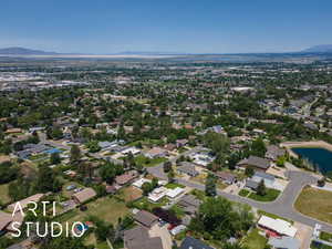 Aerial view of property and surrounding area featuring mountains