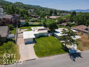 Aerial perspective of suburban area featuring a mountain backdrop