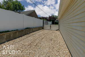 View of yard with a gate