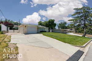 Single story home with a garage and concrete driveway