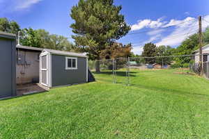 Shed behind the carport storage closet for extra storage.