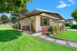 Front door entrance and stylish fence facade.