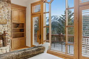 Doorway to outside featuring a mountain view