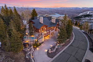 View of front of house with a chimney and a mountain view