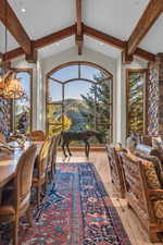 Home office with a chandelier, recessed lighting, plenty of natural light, a mountain view, and light wood-style floors