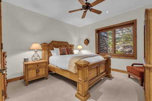 Bedroom with a ceiling fan, light colored carpet, and recessed lighting