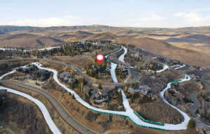 View of property location with a mountainous background and nearby suburban area