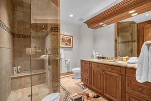 Bathroom with vanity, a stall shower, recessed lighting, and light tile patterned floors