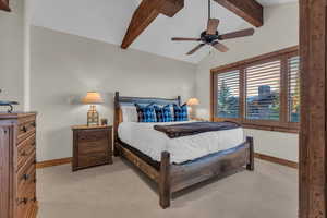 Bedroom featuring light colored carpet and a ceiling fan