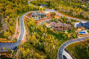View of property location featuring a forest