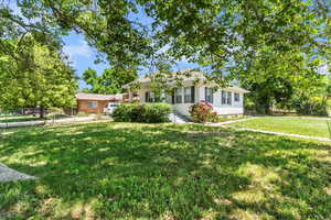 Spacious yard with shade trees