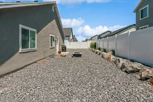 Fenced backyard with a residential view