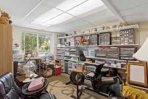 Office with a paneled ceiling