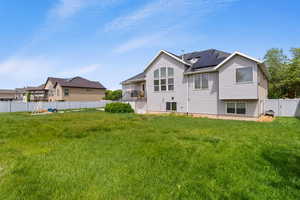 Back of property with roof mounted solar panels