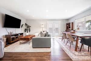 Living area with french doors, recessed lighting, and wood finished floors