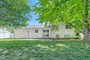 Back of property with a patio area