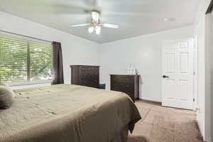Bedroom with carpet flooring and ceiling fan