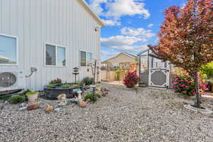 View of yard with a cooling unit and an outdoor structure
