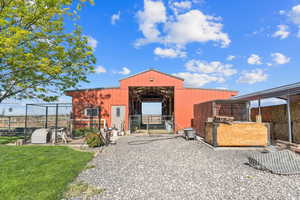 View of outbuilding with an exterior structure
