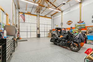 Garage featuring a garage door opener