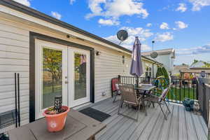 Deck with outdoor dining area and french doors