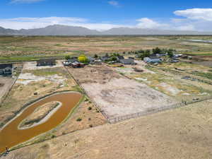 Aerial view of sparsely populated area featuring a mountainous background