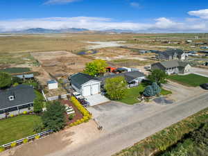 Overview of rural landscape with mountains and nearby suburban area