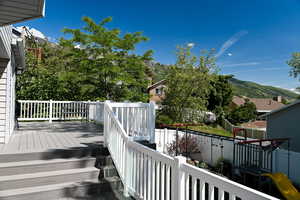 Wooden terrace featuring a mountain view