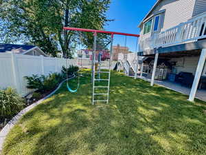 View of yard featuring a patio area and a wooden deck