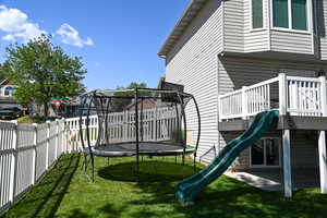 View of playground with a trampoline