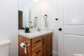 Bathroom with vanity and toilet