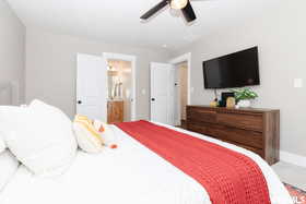 Bedroom with baseboards and a ceiling fan