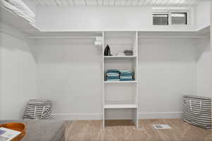 Walk in closet with carpet
