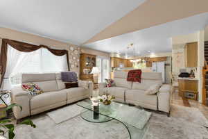 Living room featuring vaulted ceiling