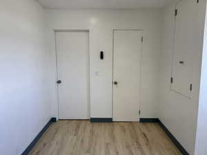 Unfurnished bedroom with light wood-style floors