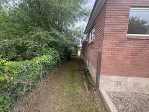 View of side of property with brick siding
