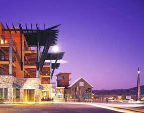 View of property at dusk