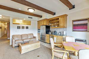 Living room with beamed ceiling