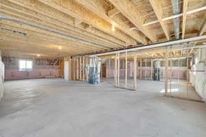 Basement featuring heating unit