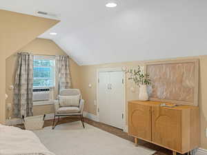 Bedroom featuring vaulted ceiling, baseboards, carpet floors, cooling unit, and recessed lighting