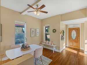 Dining room featuring a ceiling fan, wood finished floors, and baseboards