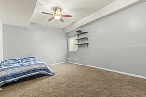 Unfurnished bedroom featuring carpet floors, baseboards, and ceiling fan