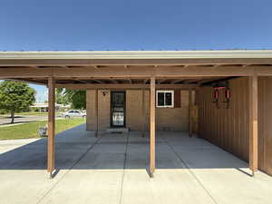View of patio / terrace featuring a carport